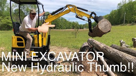 how to install a thumb on a mini excavator|mini excavator thumb cylinder.